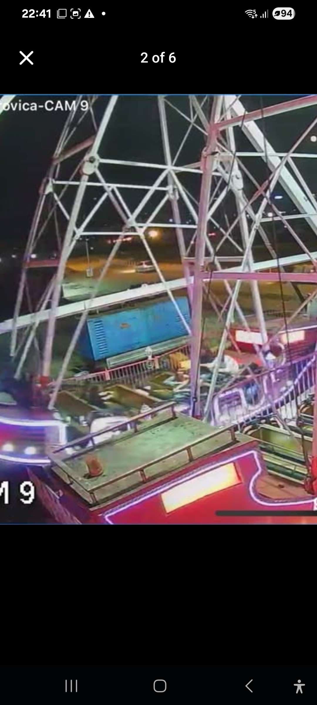 Night-time CCTV camera still showing a steel lattice tower and a red loading platform, with on-screen text “…ovica-CAM 9.”